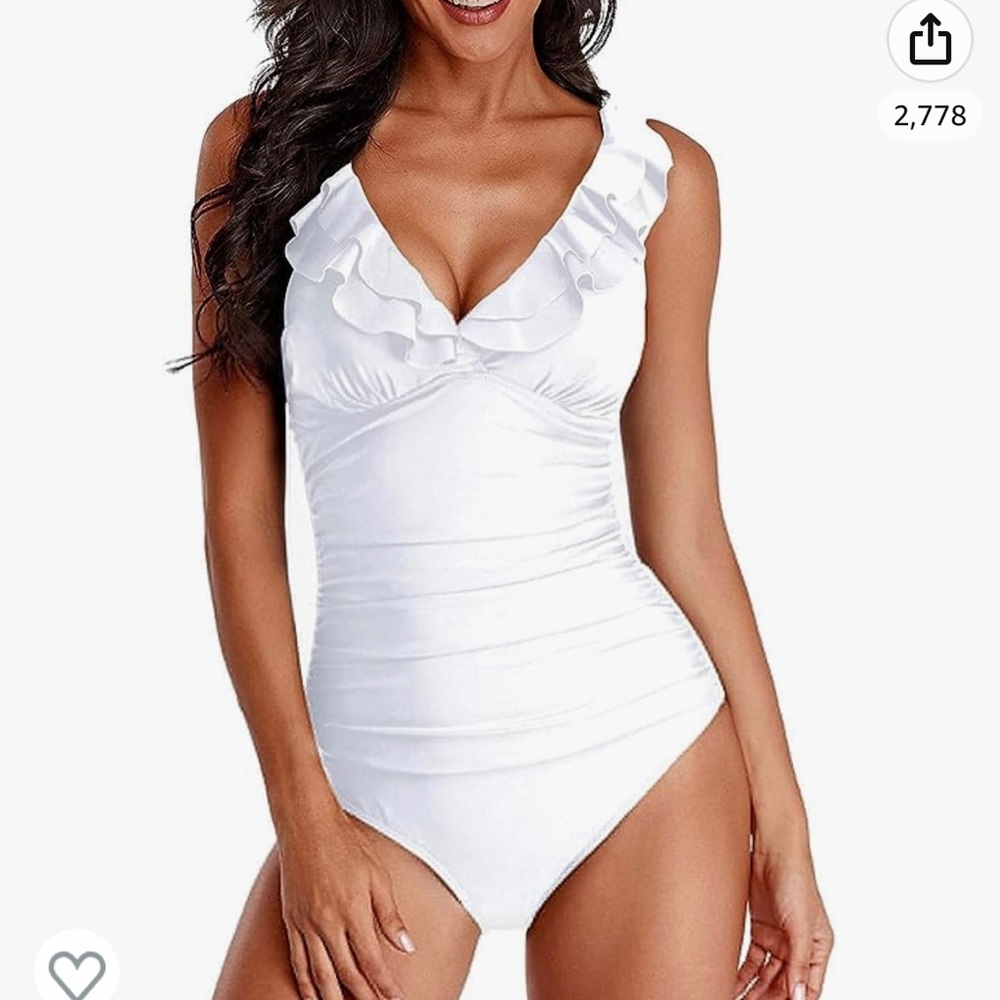 White bathing suit, worn once size large, fits 36D.
